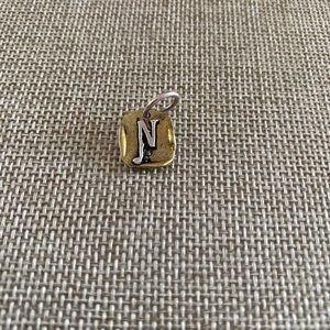 Waxing Poetic “N” brass and sterling silver charm
